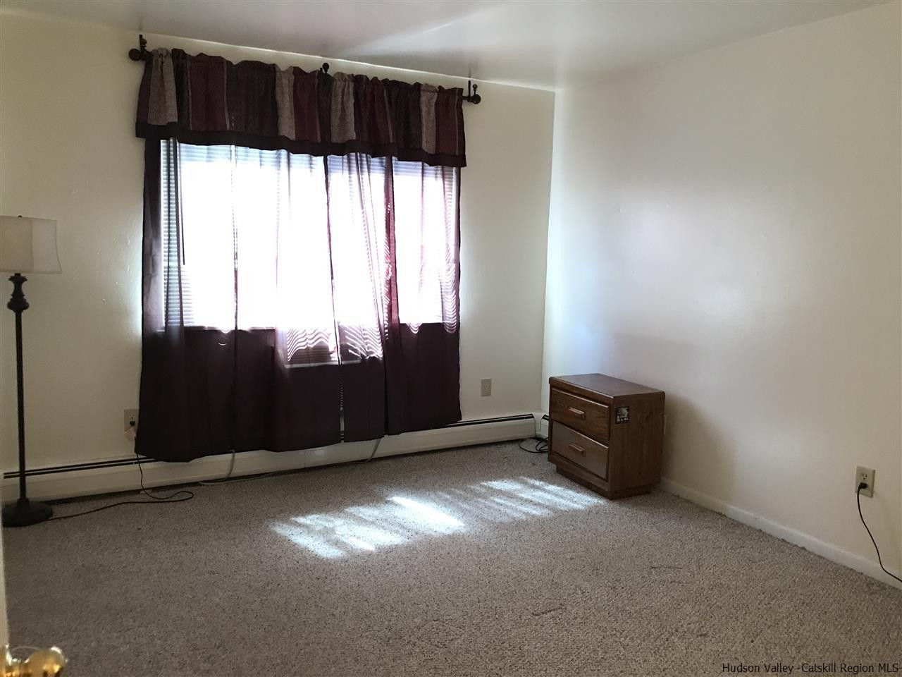 2740 South Road, Unit G7 Poughkeepsie, NY 12601 - Photo 4 of 12 a view of an empty room with a window