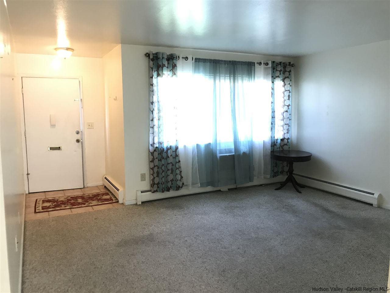 2740 South Road, Unit G7 Poughkeepsie, NY 12601 - Photo 5 of 12 an empty room with windows