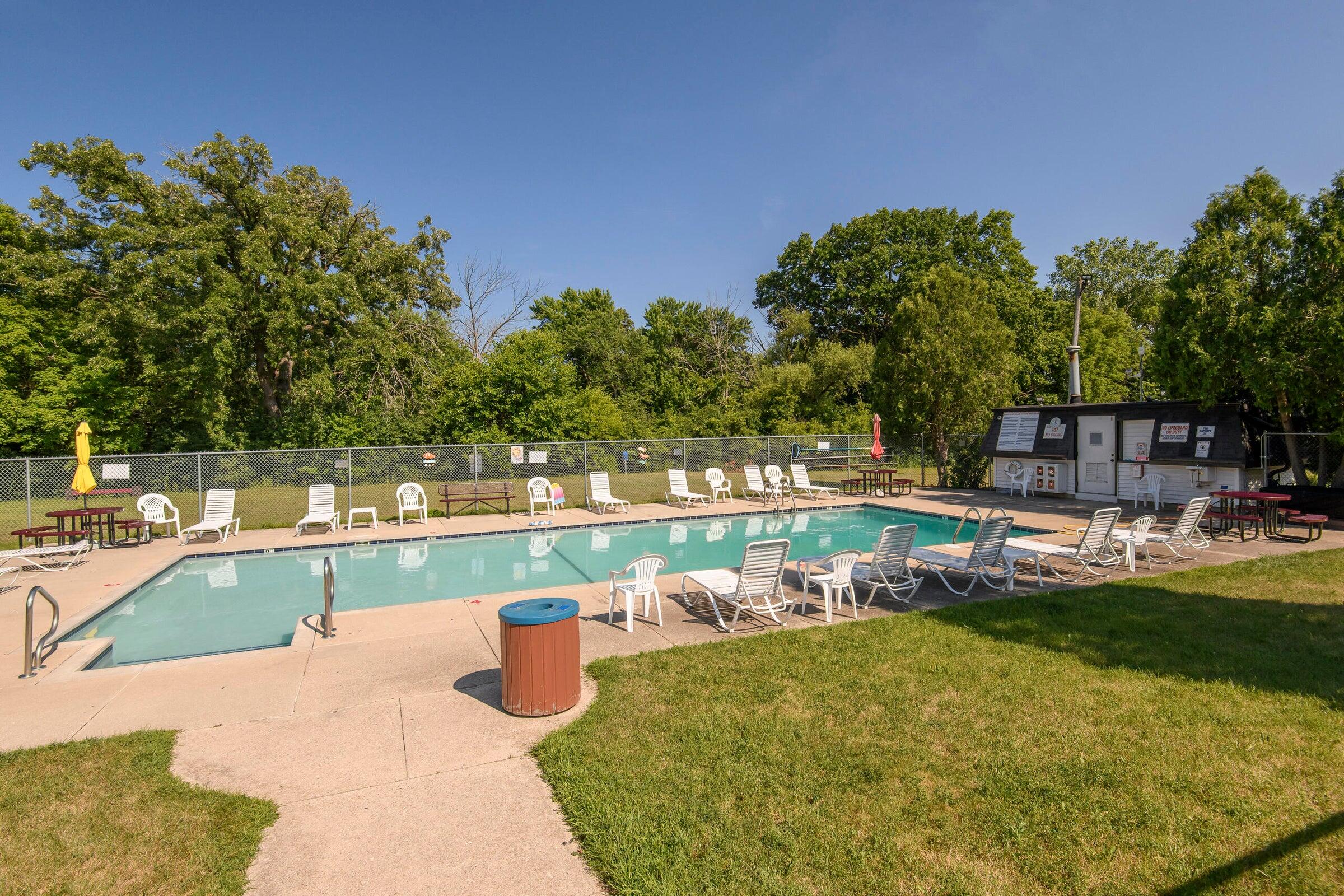 9500 North Green Bay Road, Unit 210 Brown Deer, WI 53209 - Photo 16 of 16 In-Ground Pool (Summer Photo)