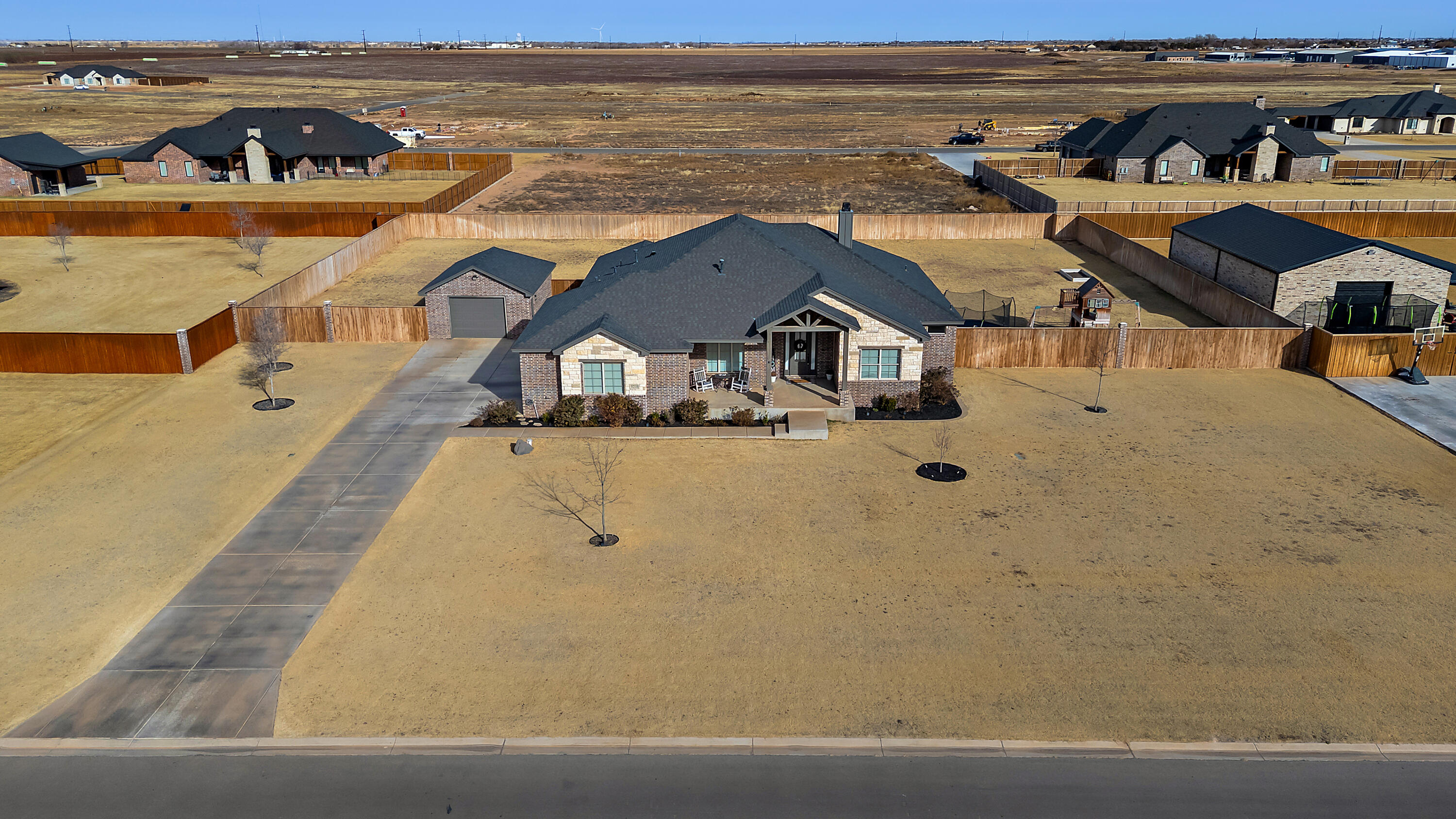 an aerial view of a house with outdoor space