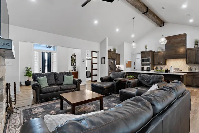 a kitchen with stainless steel appliances a refrigerator a stove and a sink