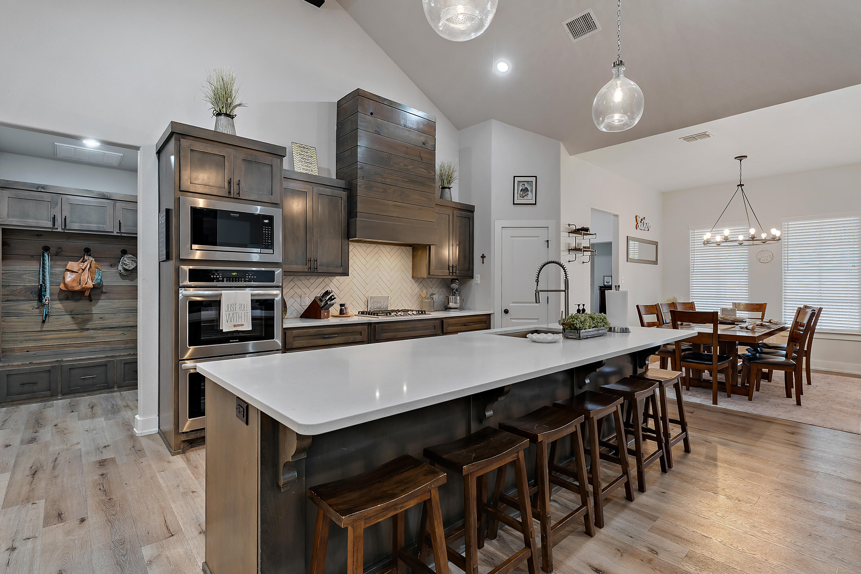 9218 County Road 6870 Lubbock, TX 79407 - Photo 14 of 45 a large kitchen with a table and chairs