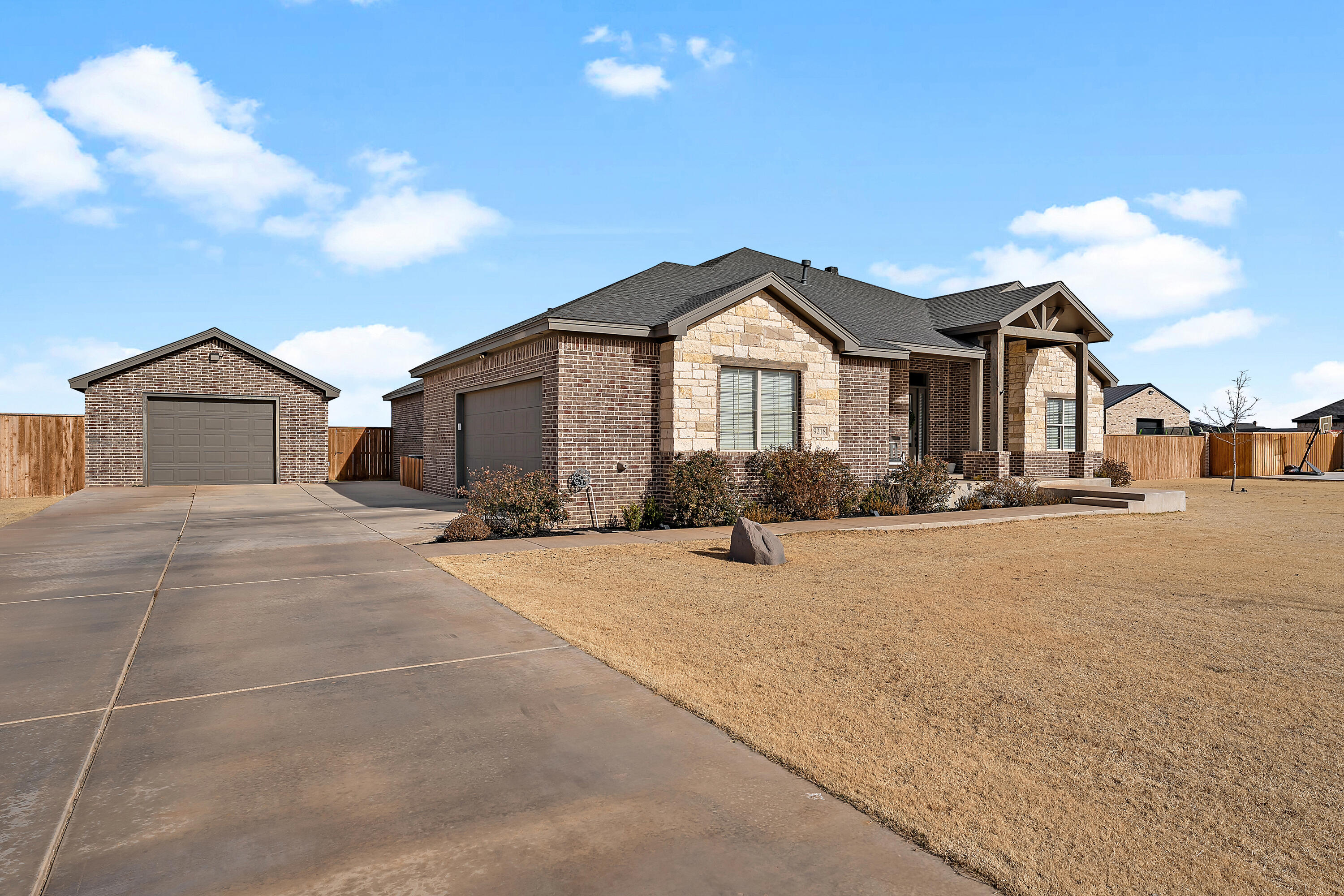 9218 County Road 6870 Lubbock, TX 79407 - Photo 2 of 45 a front view of a house with a yard