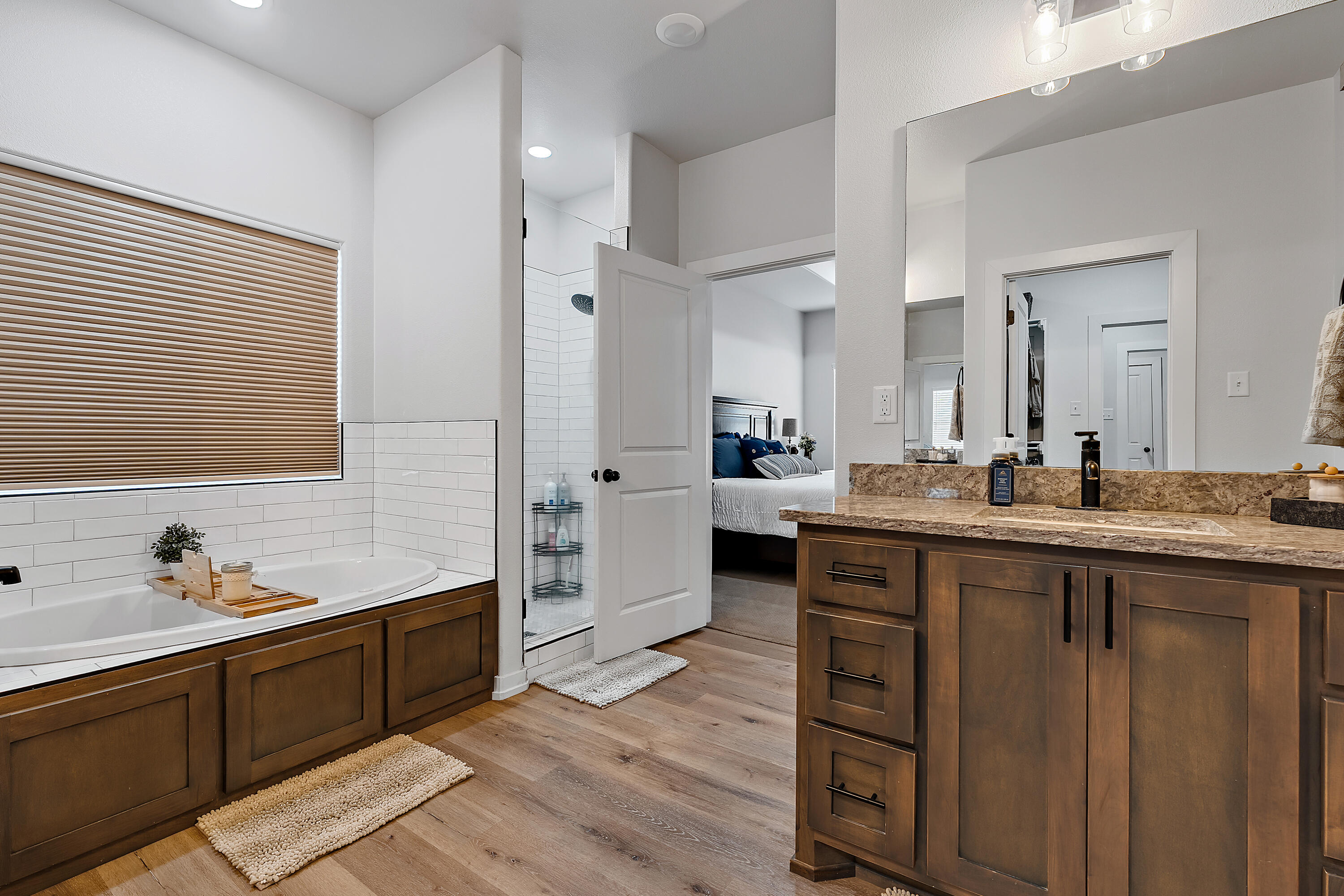 9218 County Road 6870 Lubbock, TX 79407 - Photo 23 of 45 a large kitchen with a lot of counter space and wooden floor