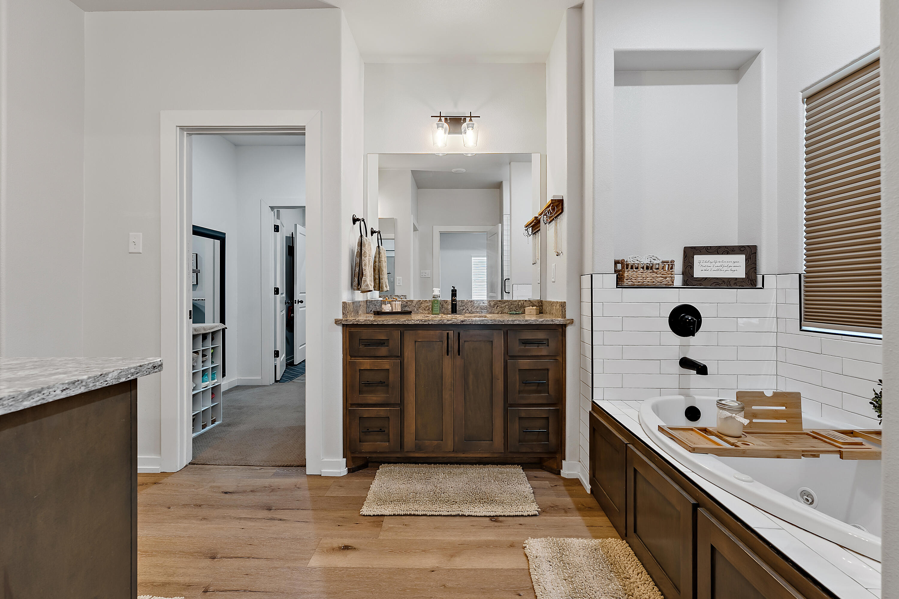 9218 County Road 6870 Lubbock, TX 79407 - Photo 24 of 45 a bathroom with a double vanity sink a mirror and shower