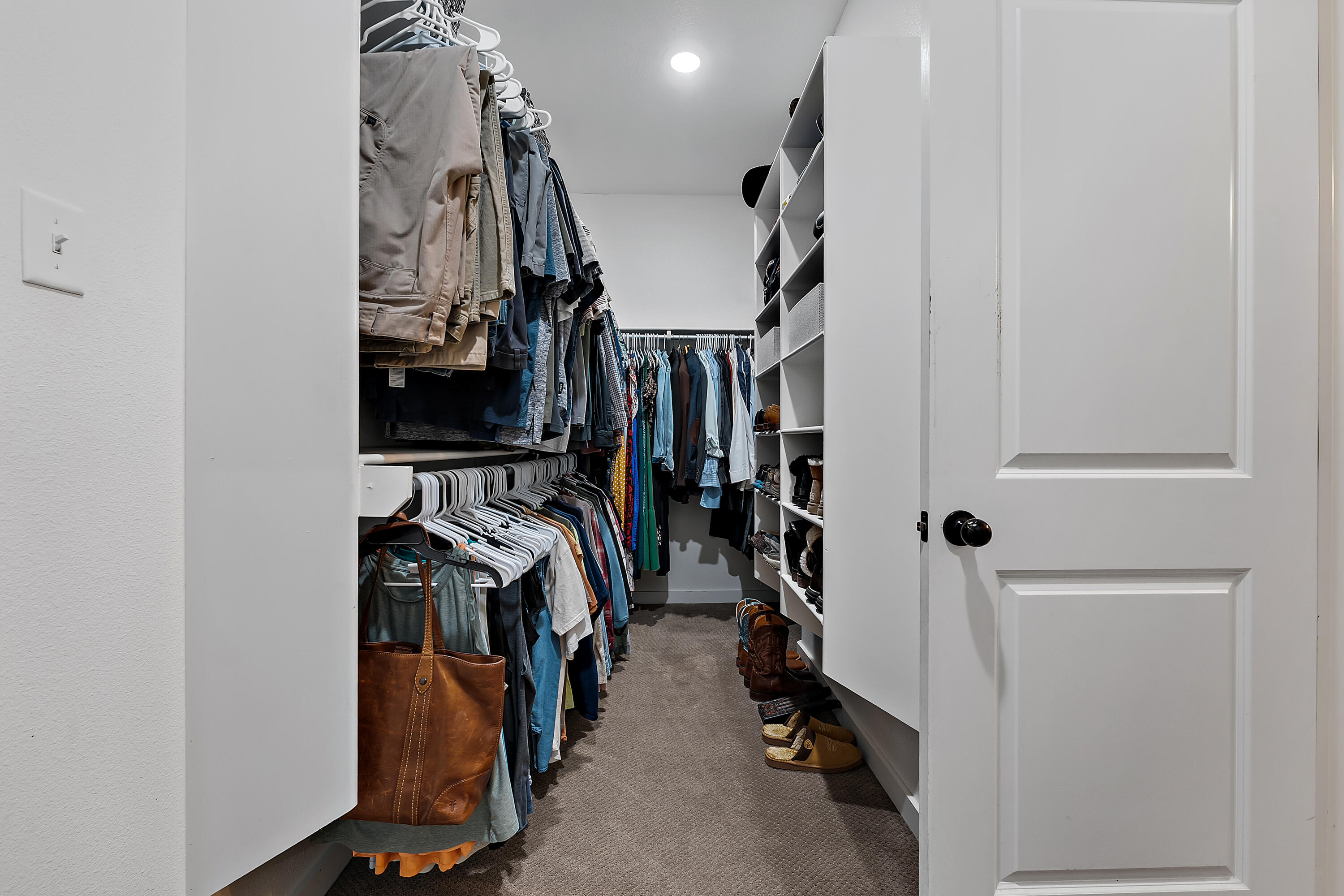9218 County Road 6870 Lubbock, TX 79407 - Photo 26 of 45 a view of walk in closet with clothes and shoes