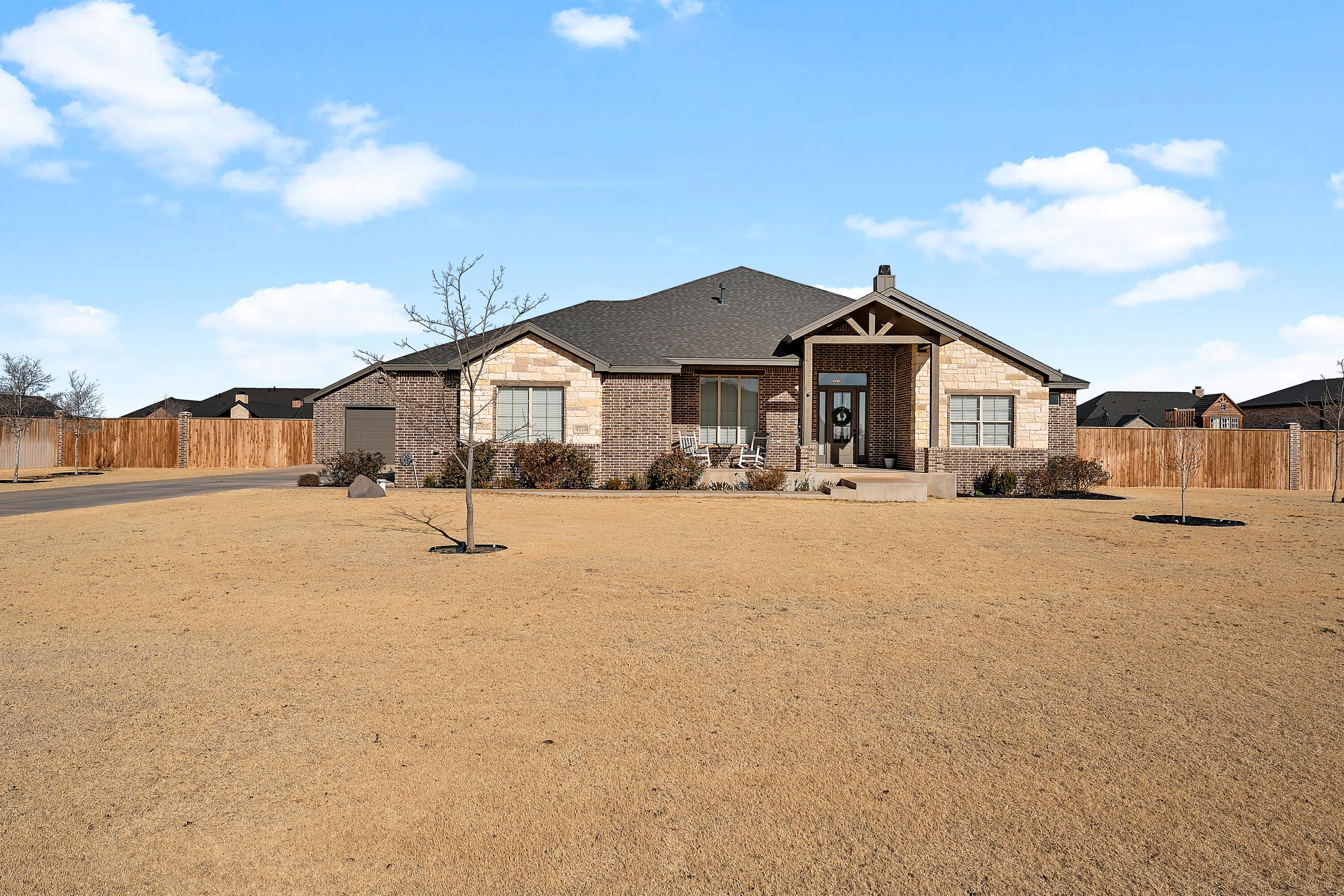 9218 County Road 6870 Lubbock, TX 79407 - Photo 3 of 45 a front view of a house with a yard