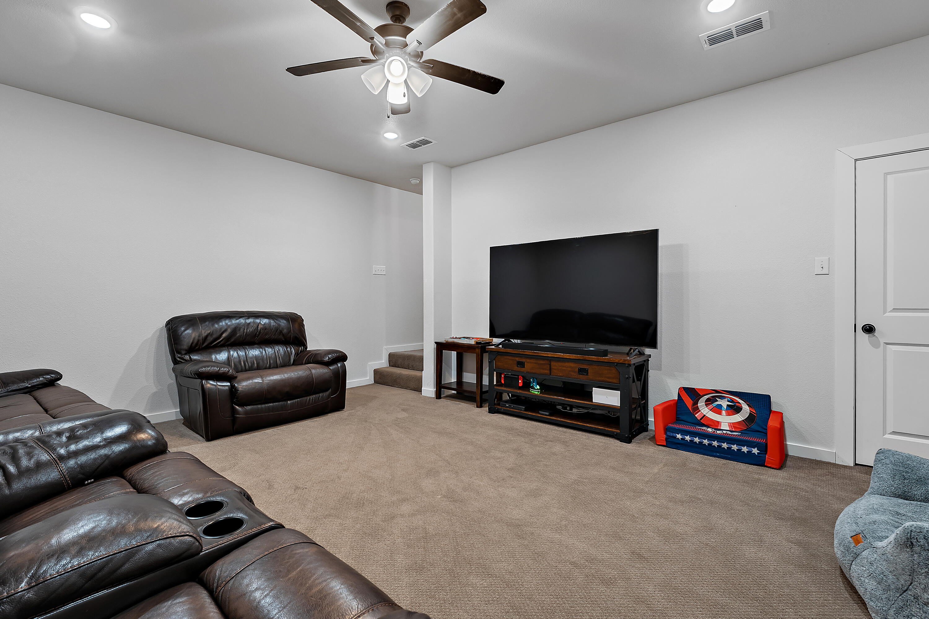 9218 County Road 6870 Lubbock, TX 79407 - Photo 34 of 45 a living room with furniture and a flat screen tv