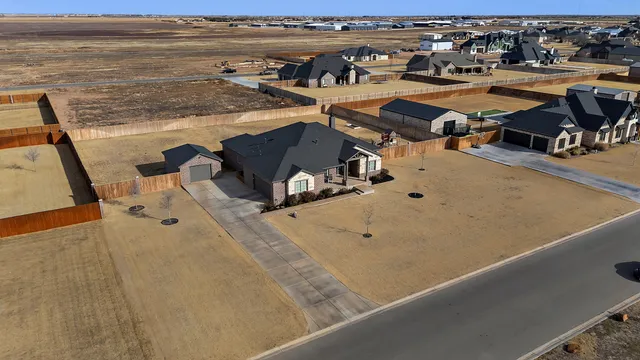 wooden floor with view of living room