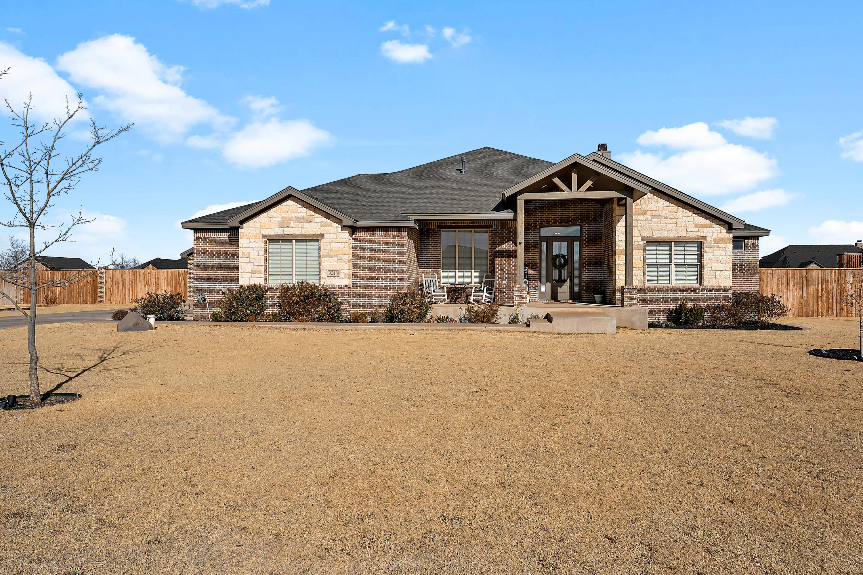 9218 County Road 6870 Lubbock, TX 79407 - Photo 4 of 45 a front view of a house with a yard