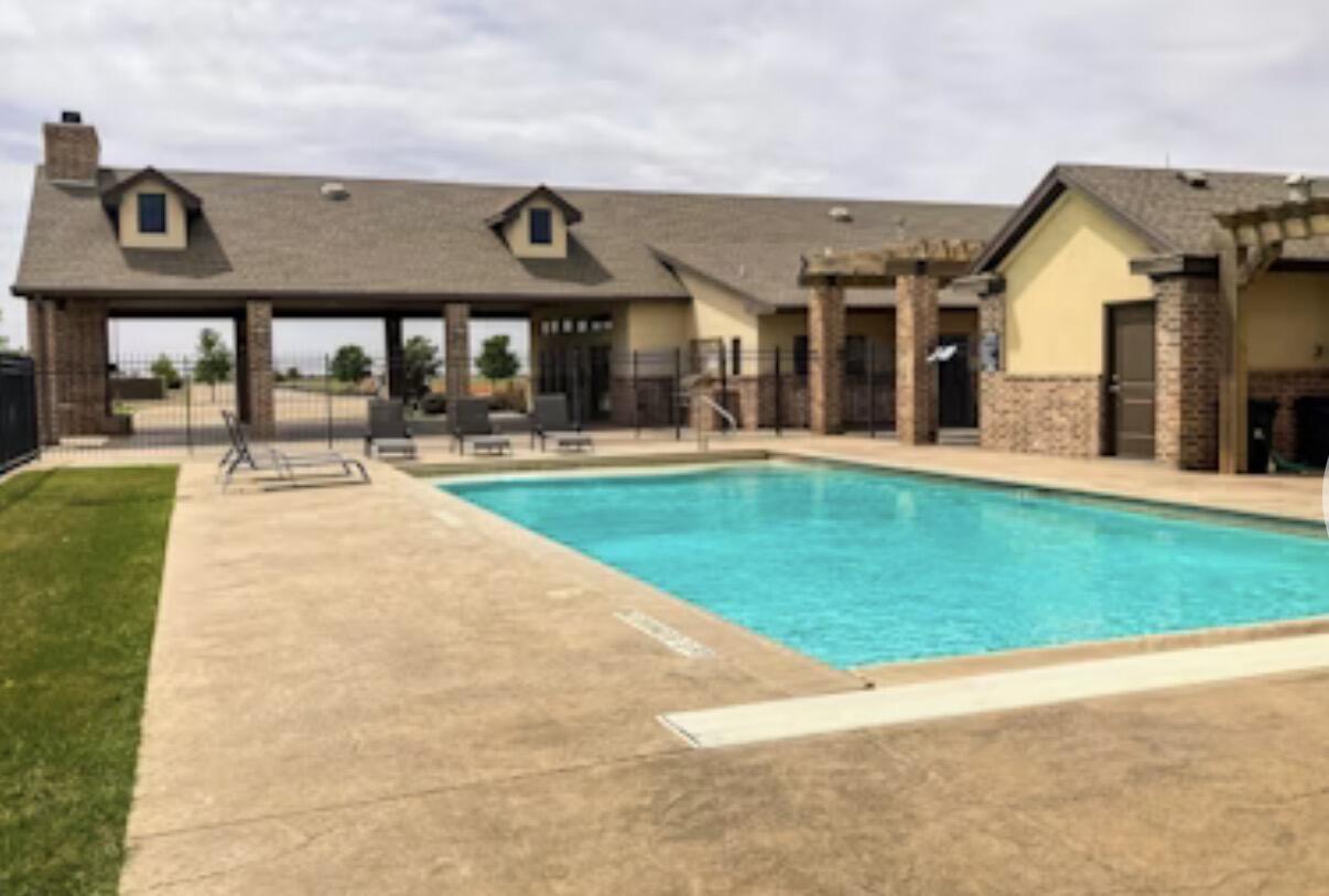 9218 County Road 6870 Lubbock, TX 79407 - Photo 44 of 45 a front view of a residential apartment building with a yard