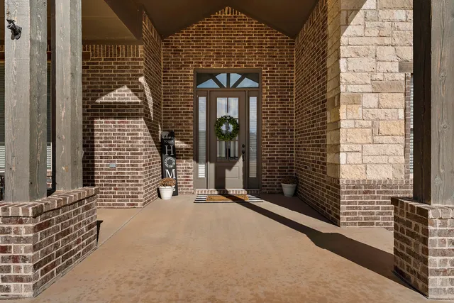 a front view of a house with a glass door