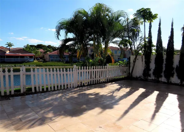 a view of a wrought iron fences in front of house