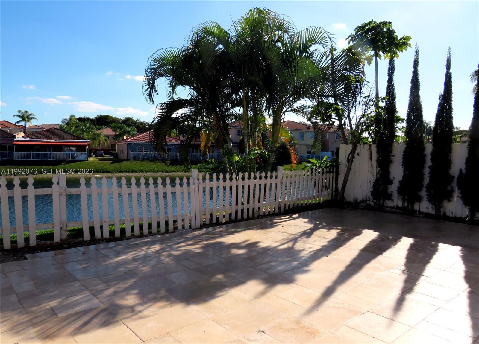 16330 Southwest 102nd Street Miami, FL 33196 - Photo 14 of 30 a view of a wrought iron fences in front of house