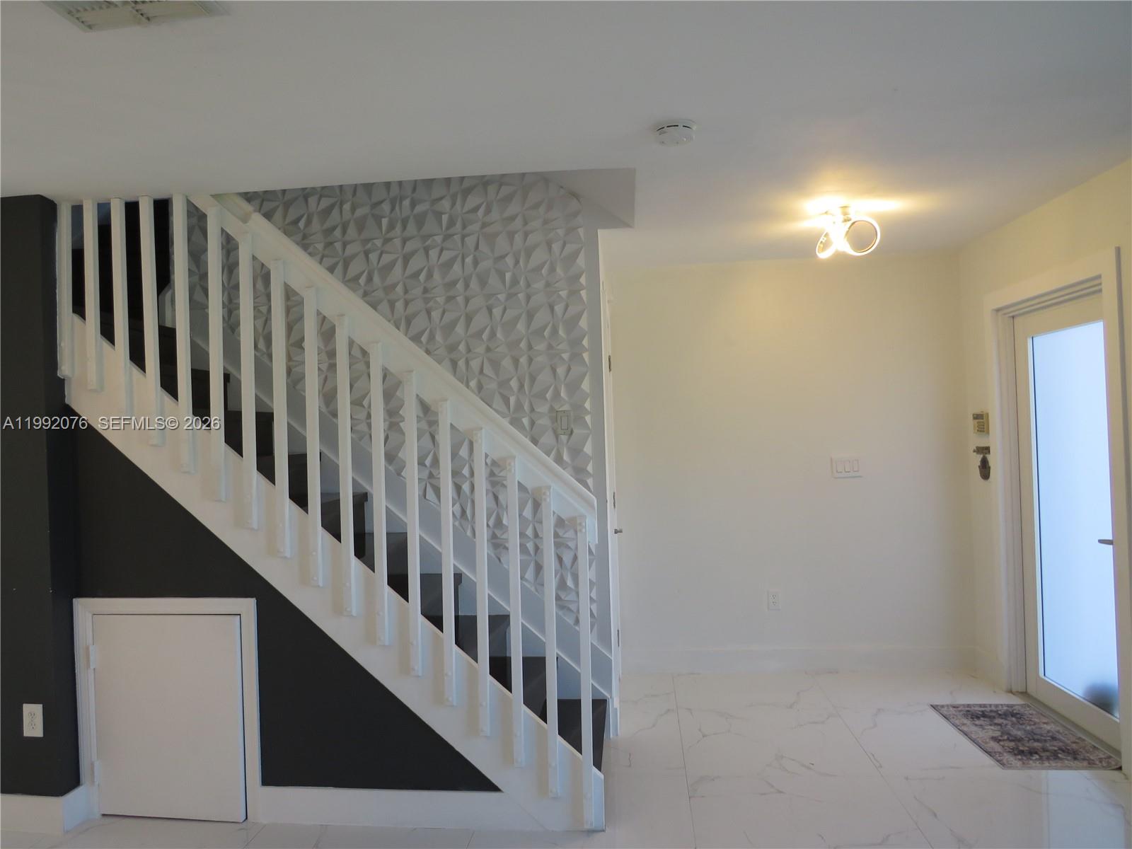 16330 Southwest 102nd Street Miami, FL 33196 - Photo 17 of 30 a view of entryway with wooden floor