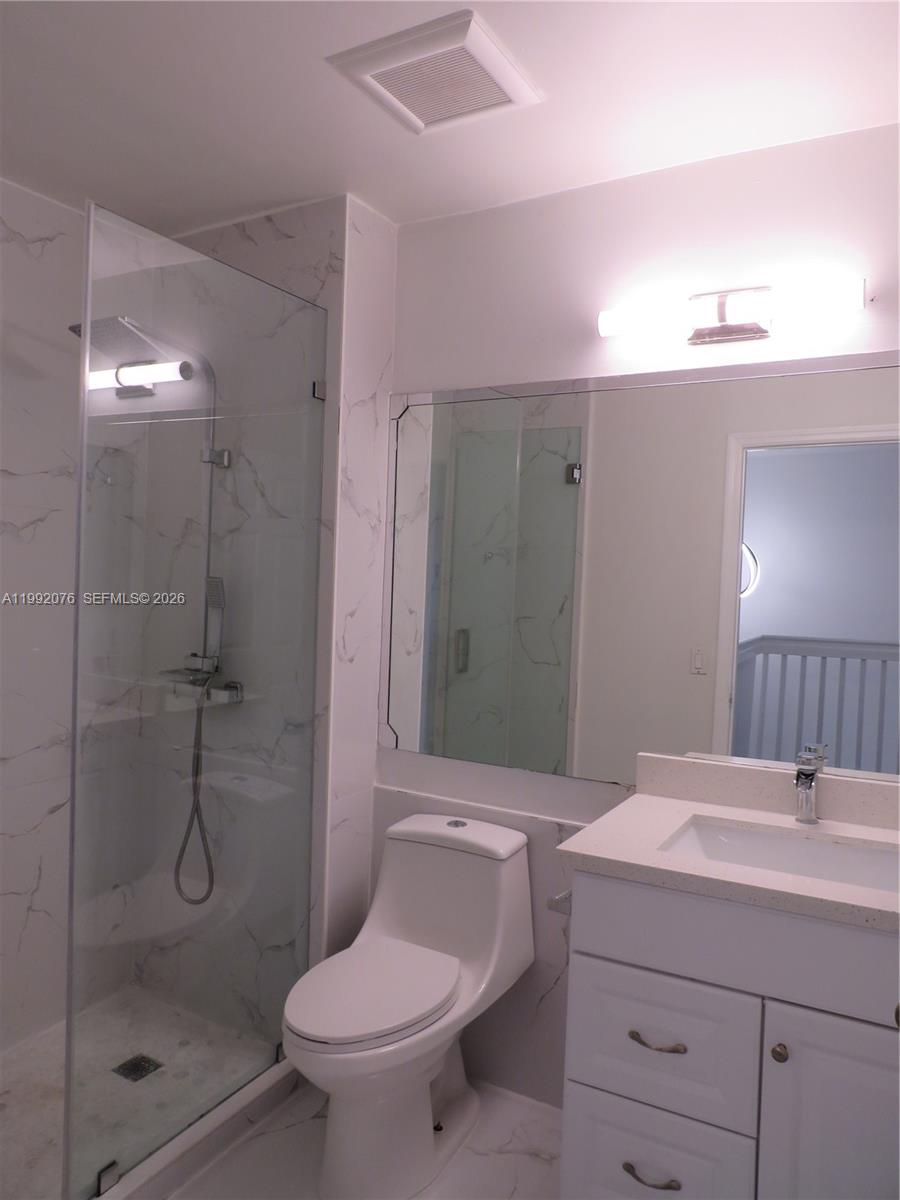 16330 Southwest 102nd Street Miami, FL 33196 - Photo 20 of 30 a bathroom with a sink toilet and shower