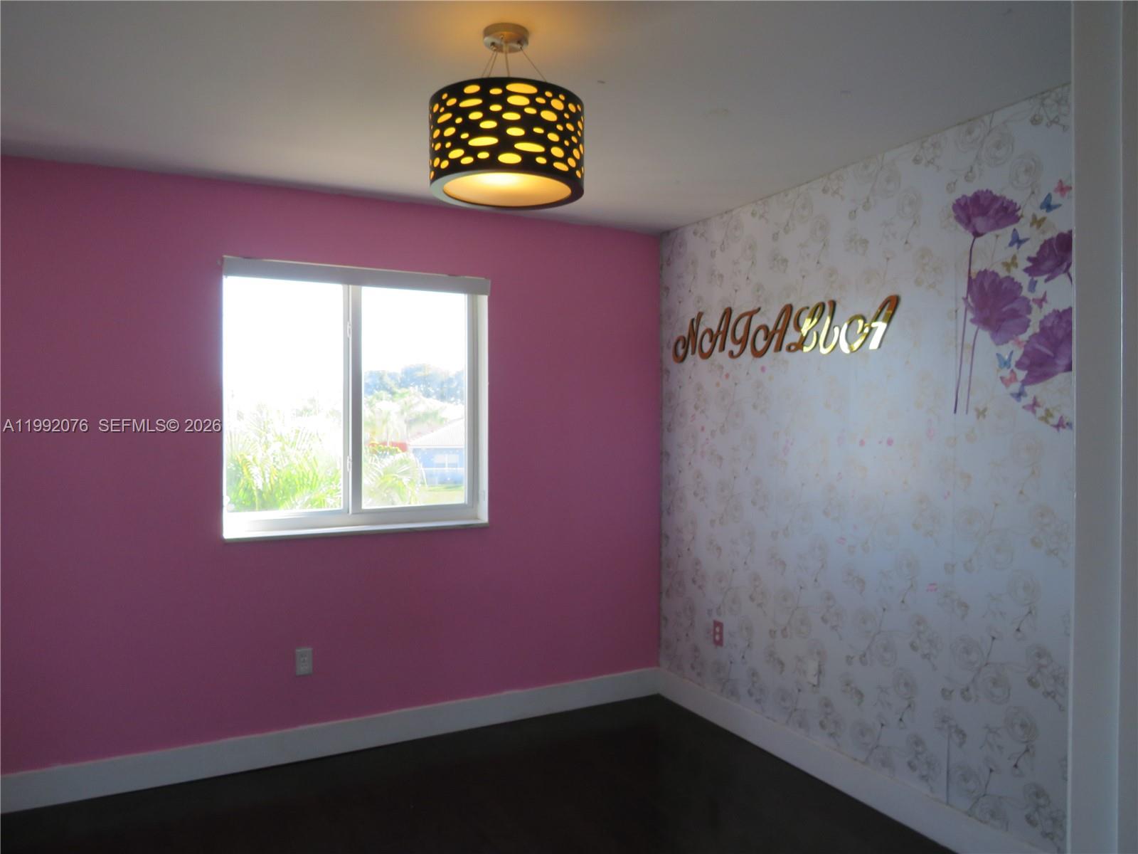 16330 Southwest 102nd Street Miami, FL 33196 - Photo 21 of 30 a view of an empty room with a window