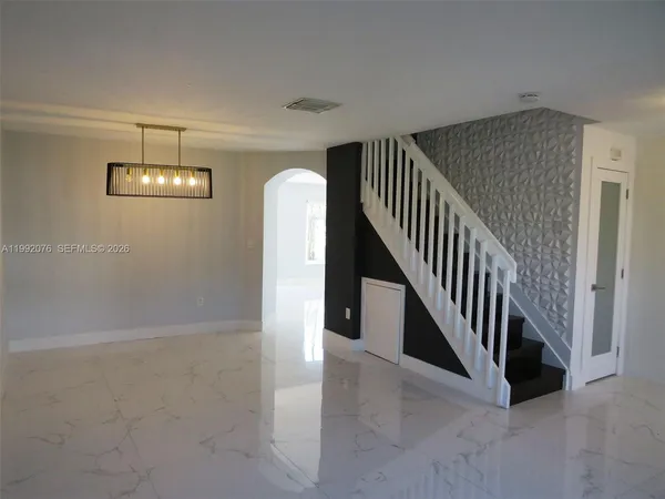 a view of a hallway with staircase