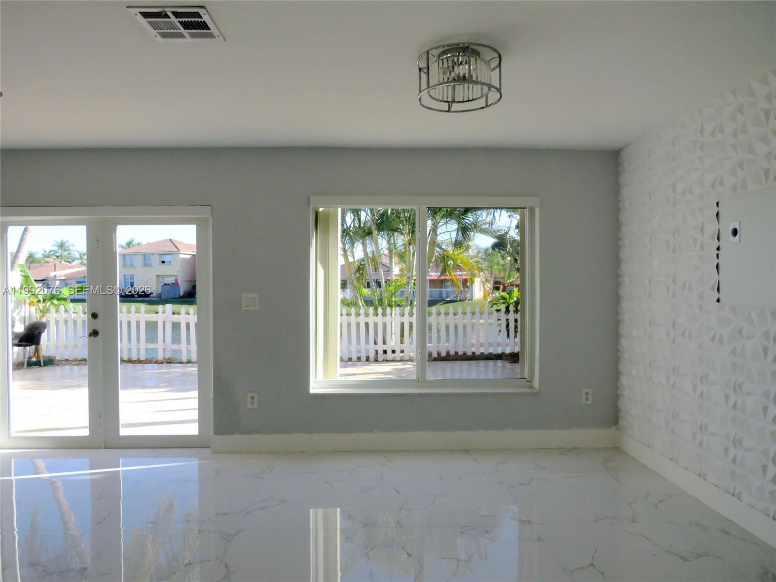 16330 Southwest 102nd Street Miami, FL 33196 - Photo 10 of 30 a view of an empty room with a window