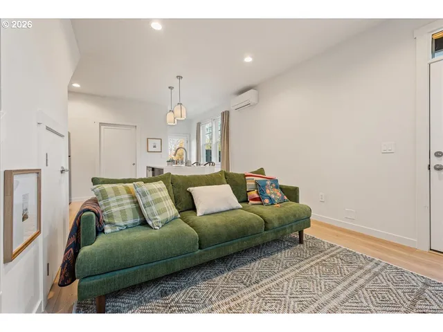 a living room with furniture and a rug