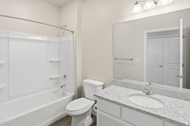 1838 West 300th Street South, Unit B Mapleton, UT 84664 - Photo 27 of 51 Bathroom featuring a white tub/shower combination, a vanity with a light-colored countertop, and a large wall-mounted mirror