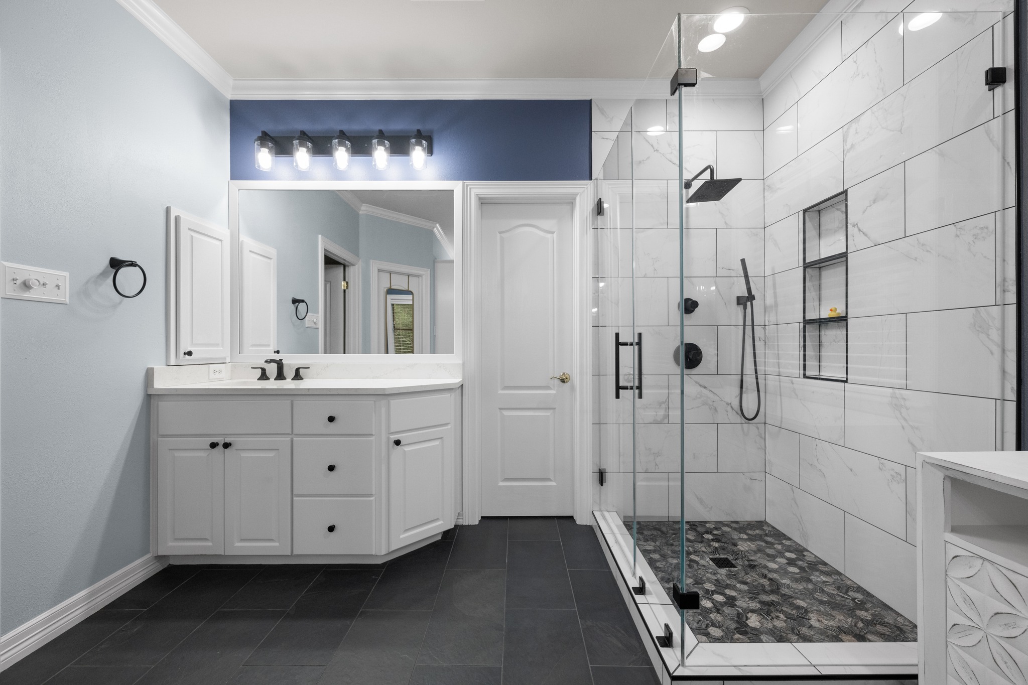 6004 Mt Bonnell Road Austin, TX 78731 - Photo 15 of 24 a bathroom with a sink a double vanity and a mirror