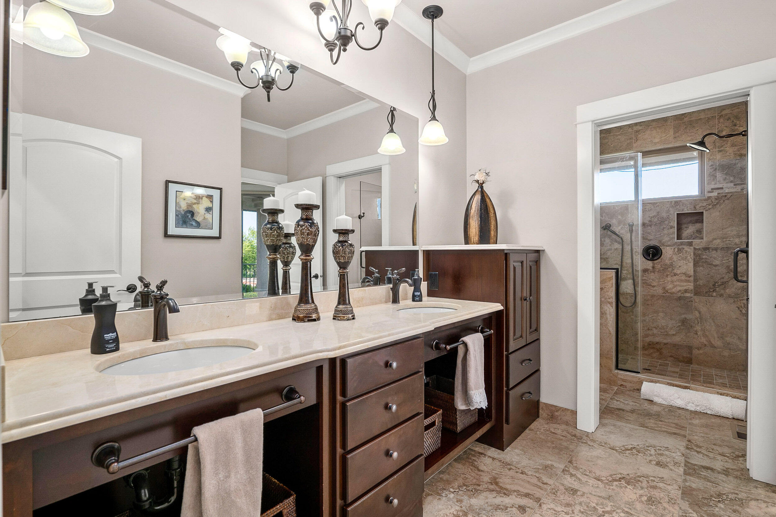 5709 Hughes Road Medford, OR 97504 - Photo 37 of 70 a bathroom with a granite countertop sink a large mirror and shower