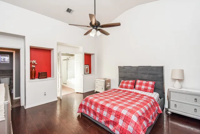a view of walk in closet with clothes