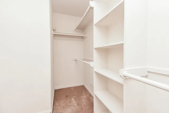 a en suite bathroom with a tub sink and mirror