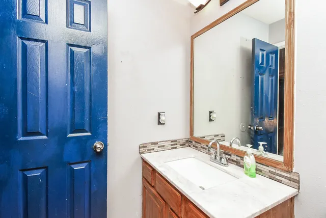 a bedroom with a bed and a bookshelf