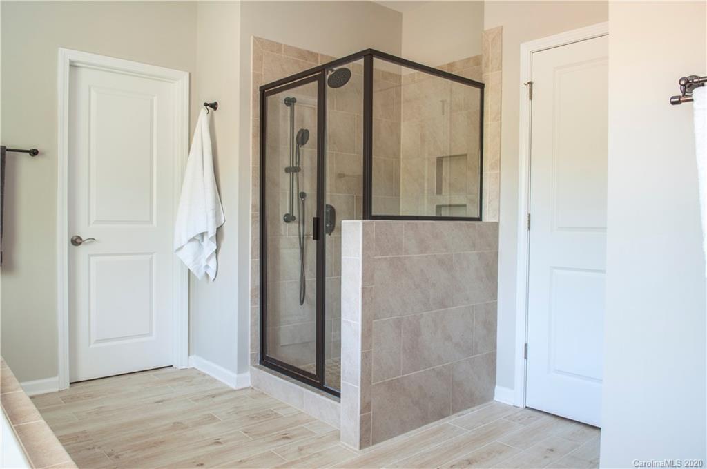 5554 Braddock Ml Way Lancaster, SC 29720 - Photo 16 of 33 a bathroom with a shower and a glass door
