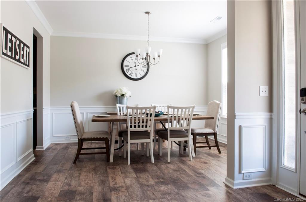5554 Braddock Ml Way Lancaster, SC 29720 - Photo 3 of 33 a view of a dining room with furniture window and wooden floor