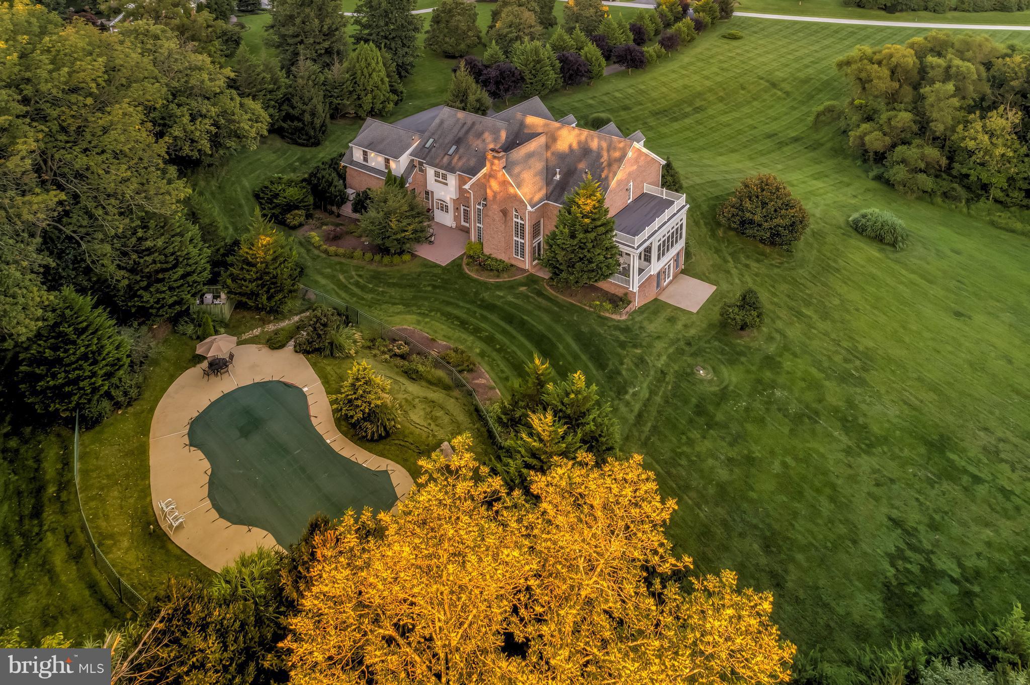1128 Western Run Road Cockeysville, MD 21030 - Photo 28 of 30 an aerial view of a house with a yard and large trees