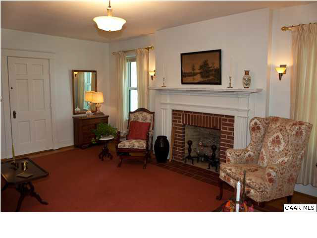 425 Madison Road Stanardsville, VA 22973 - Photo 3 of 23 a living room with furniture and a fireplace