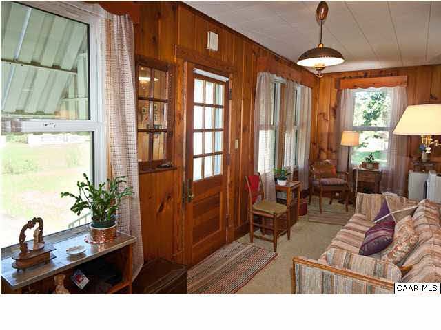 425 Madison Road Stanardsville, VA 22973 - Photo 5 of 23 a living room with furniture a window and a chandelier