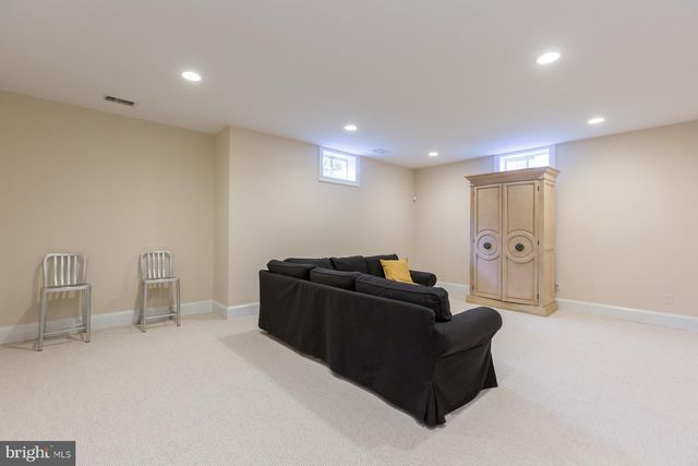 a bathroom with a sink a mirror and window