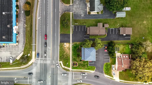 an aerial view of a residential apartment building with a yard