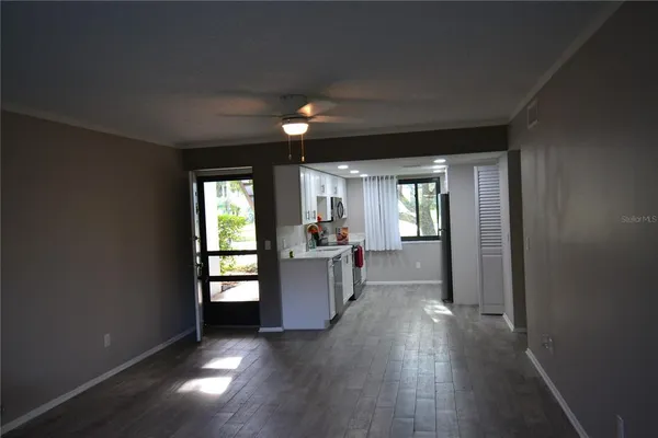 wooden floor in an empty room with a window
