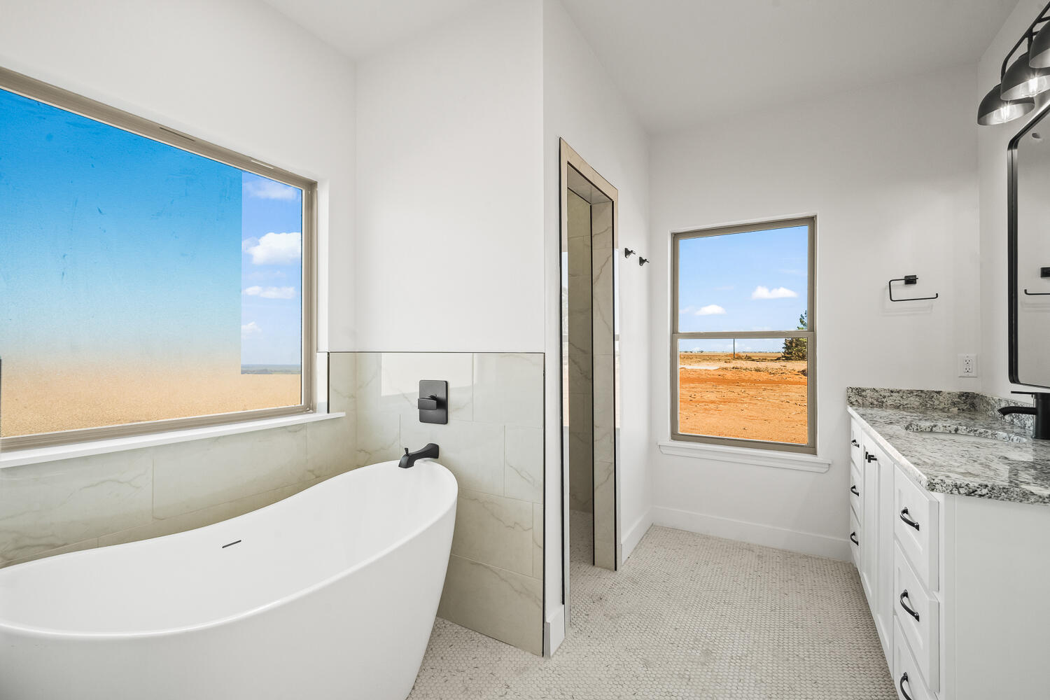 4062 Hawk Road Ropesville, TX 79358 - Photo 13 of 45 a bathroom with a granite countertop tub sink and mirror