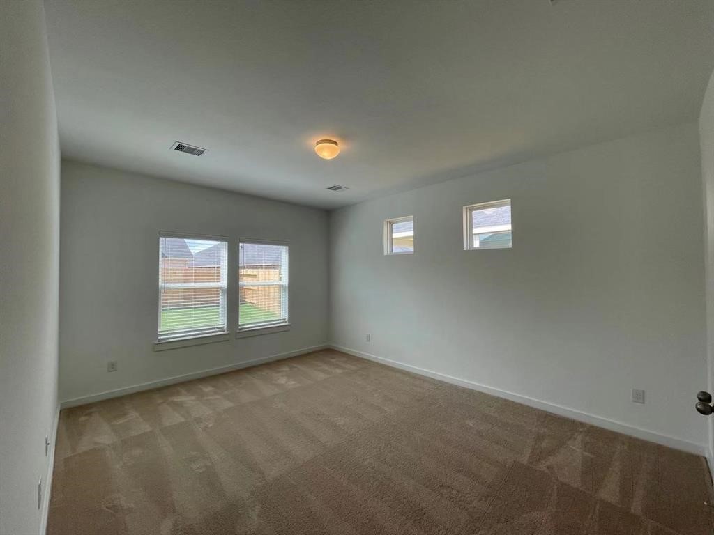 815 Summer Village Way Rosenberg, TX 77469 - Photo 10 of 21 an empty room with a empty space and windows