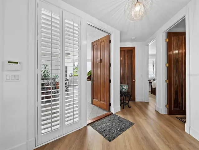 a balcony with furniture and flowers