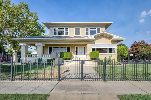 front view of a house with a garden