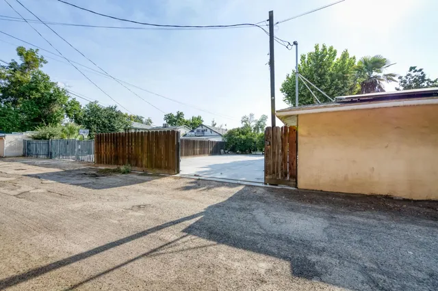 an aerial view of a residential houses with outdoor space