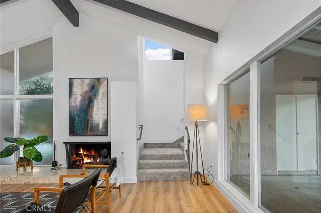 a bedroom with a bed and a lamp