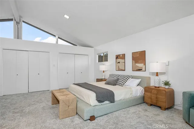 a bed room with a bed and a window