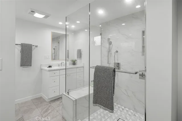 a bathroom with a shower and a sink