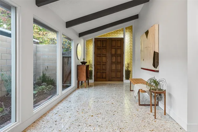 a view of a livingroom with furniture and windows