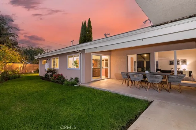 a view of a patio with a table and chairs