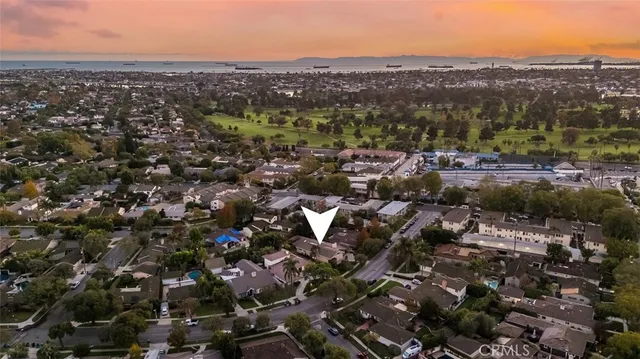an aerial view of multiple houses with yard