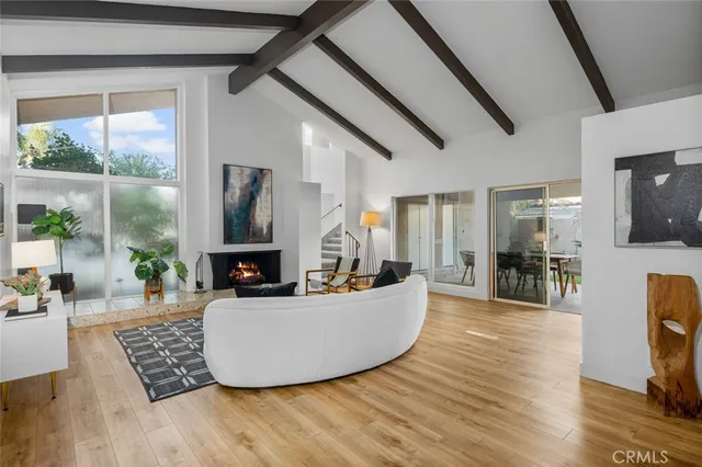 a living room with fireplace furniture and a flat screen tv